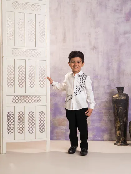 A full length view of the custom ant embroidered shirt. This piece is a perfect example of how I can bring a unique and personalized idea to life for a special birthday outfit.