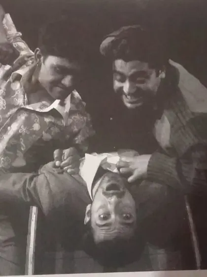 A throwback to our director Mr. Binod Sharma's work as an actor in the NSD Repertory Company. This black and white photo captures a moment of intense physical comedy.