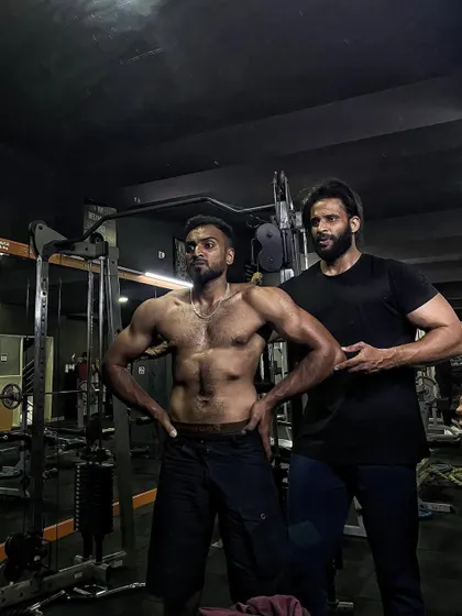 Another shot of me coaching a client on his posing. The final presentation is just as important as the training itself.