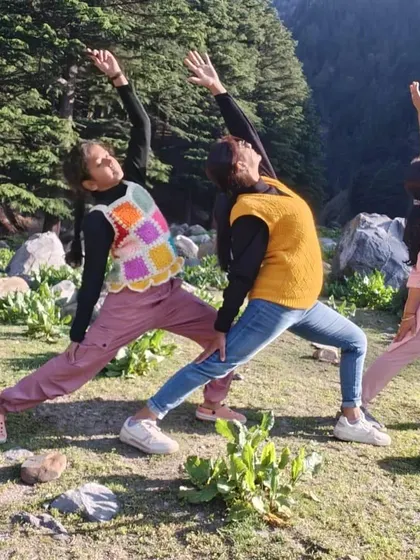 Three generations, one yoga pose. Practicing Reverse Warrior together in nature, showing that yoga is a practice for everyone, uniting us across ages.