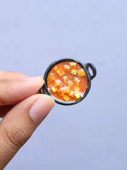 A tiny bowl of paneer butter masala, a classic dish from my North Indian thali course.