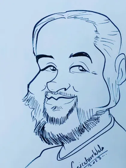 A friendly-looking man with a beard. I enjoy capturing the warmth in people's smiles.