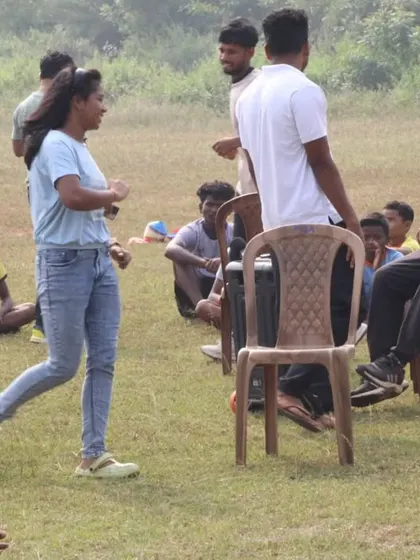 A game of musical chairs brings laughter and excitement to the Children's Day celebration. These simple, fun activities create lasting, positive memories for the children.
