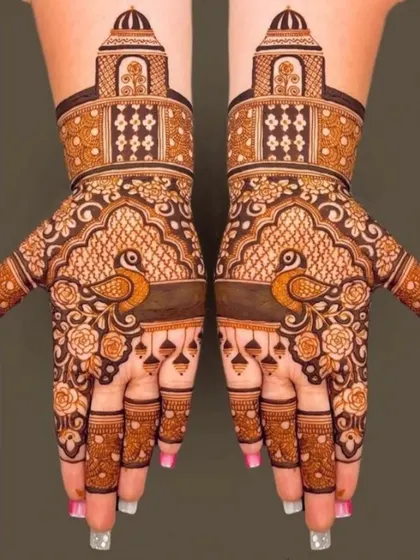 A very graceful design featuring peacocks on the palms, surrounded by floral patterns and topped with architectural domes.