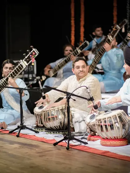 Another angle from the Sitar Symphony, showing the beautiful synchronicity of so many sitars playing together, supported by the rhythm section.