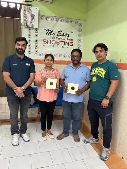 A proud moment for these new shooters after completing their first session. They are holding up their targets, showing the great results of their focus and my coaching.