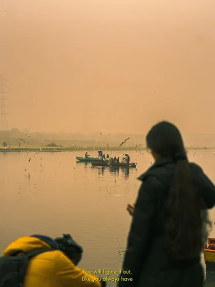 A fellow photographer capturing the morning scene at Yamuna Ghat. It's always interesting to see a scene from a different perspective, including those who are also there to document it.