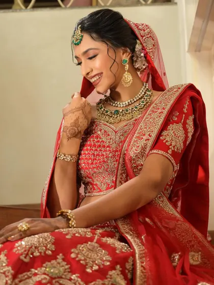 A candid shot of the bride, her happy smile is the best accessory.