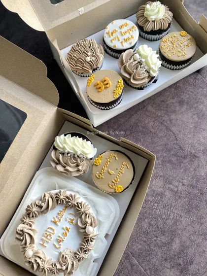 A beautiful hamper box featuring a custom bento cake and matching cupcakes. This makes a wonderful and complete gift for a birthday or any celebration.