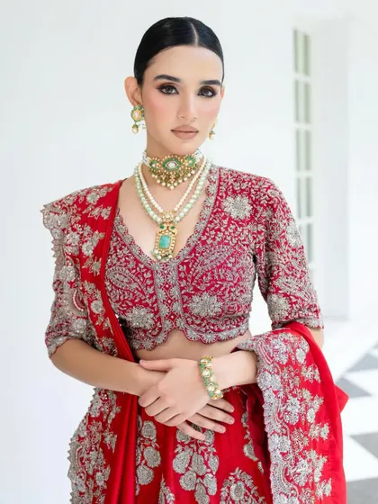 Another angle of this stunning Jayanti Reddy creation, focusing on the V-neck blouse and the exquisite layered jewellery. The styling is clean and elegant, letting the craftsmanship speak for itself.