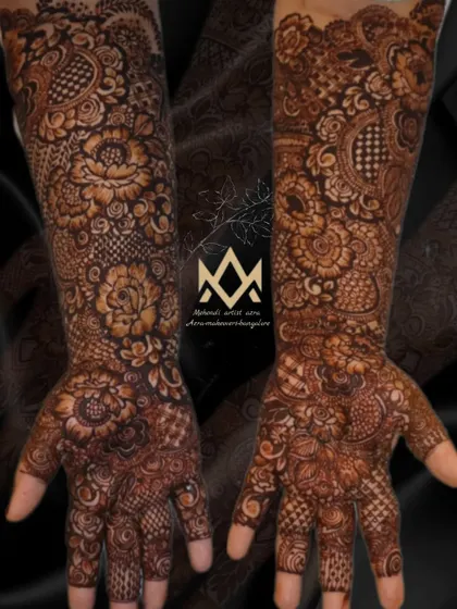 A complete view of both arms, showing the symmetrical and intricate floral patterns of this bridal design.