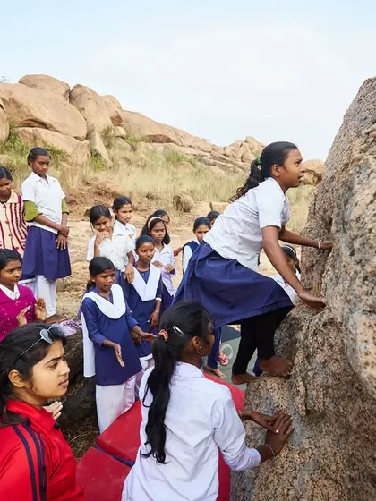 The highlight of the Bengal Boulder Fest was our session with local schoolgirls. Here, a girl in her school uniform bravely tackles the rock for the first time.