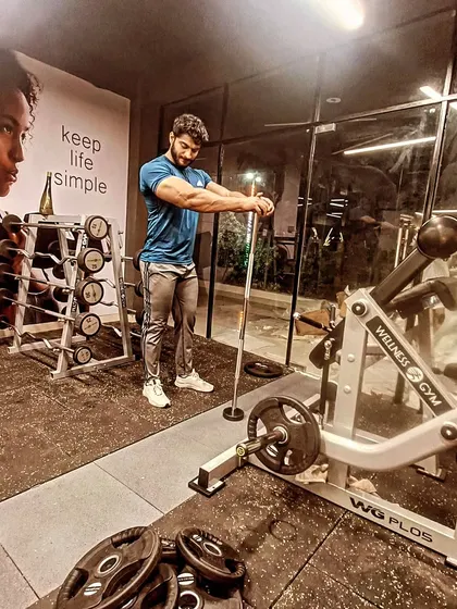 Focused on an arm workout. Building impressive arms requires hitting both the biceps and triceps with intensity and proper form.