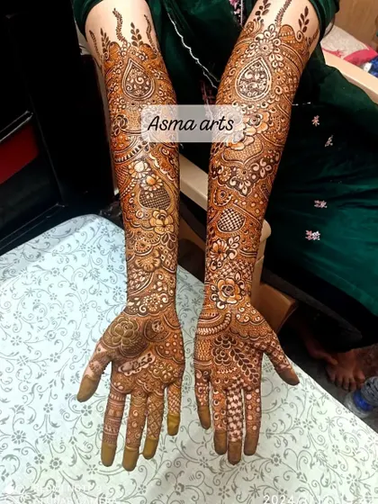 This full-arm design is packed with detail, including paisleys, flowers, and delicate dotted patterns. It's a testament to the patience and passion I put into every bridal henna.