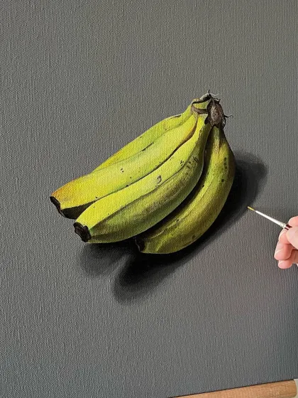 A realistic painting of a bunch of bananas. I used acrylic paint on a dark canvas to make the bright yellow-green of the bananas stand out.