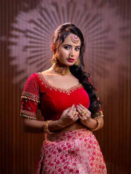 This series features a model in a red lehenga, wearing a simple but elegant gold-toned choker set. This is a great option for a pre-wedding puja or sangeet.