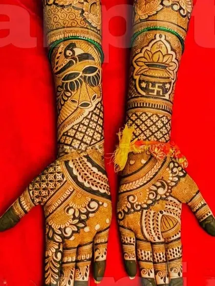 This design features a cow and calf, a symbol of love and prosperity, along with a swastika and kalash for blessings.