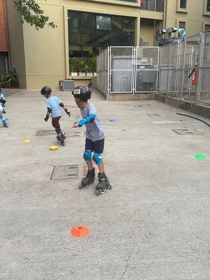 Kids in motion during a group skating class. You can see the varying levels of skill, but everyone is participating and having fun, which is what our program is all about.