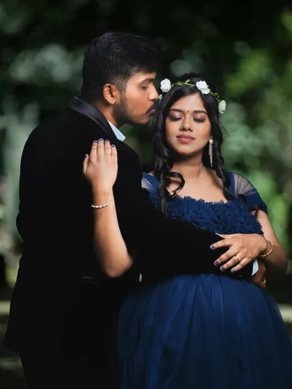 An intimate moment between the couple during their maternity shoot. The focus is on their connection and the shared anticipation.