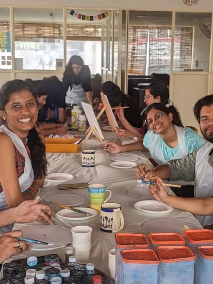 A collage from a busy workshop day, featuring participants creating doodles, calligraphy, resin art, and dot mandalas.