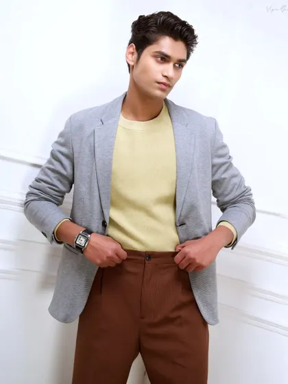 A three-quarter length shot for a male model's portfolio. This type of image is essential as it shows the model's physique and how he carries himself in clothing.