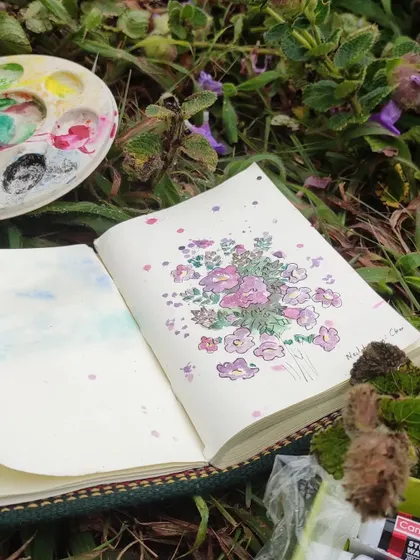 My watercolor palette and sketchbook right in the middle of the Neelakurinji fields. For me, art is about being present and capturing the essence of a moment directly from nature.