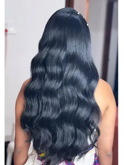 A simple yet stunning open hairstyle with glossy, healthy-looking waves.