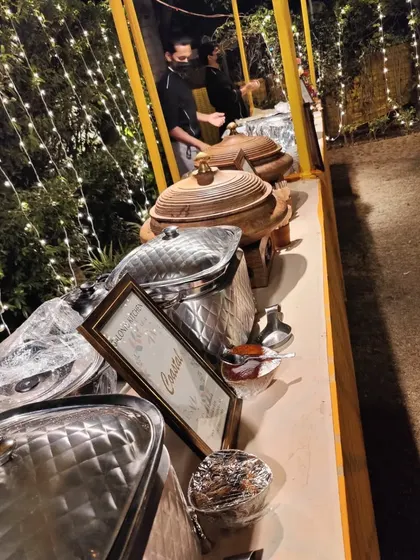 A shot of the buffet line at an outdoor Diwali party, with my team ready to serve guests.