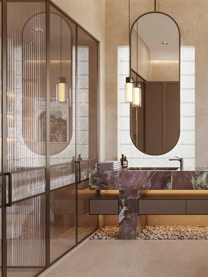 A fluted glass partition separates the main bathroom area from the toilet, providing privacy while allowing light to filter through.