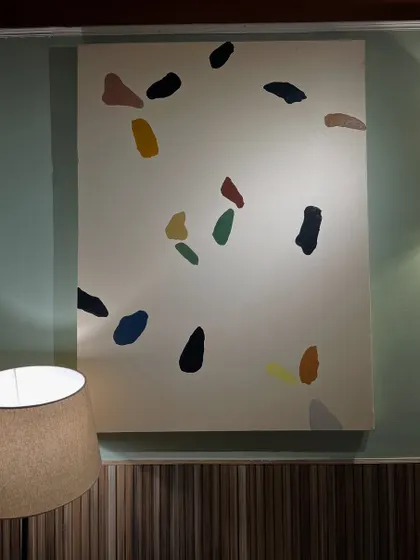 The terrazzo-style painting installed at the Sidewalk cafe in Kanpur. Its playful pattern adds a touch of modern fun to the wall.