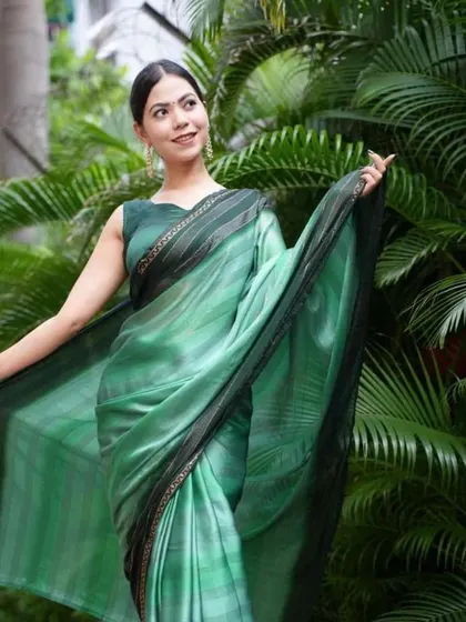 A beautiful shaded green satin saree from my ready-to-wear collection. The smooth, flowing fabric drapes elegantly, and the pre-stitched design makes it a breeze to wear.
