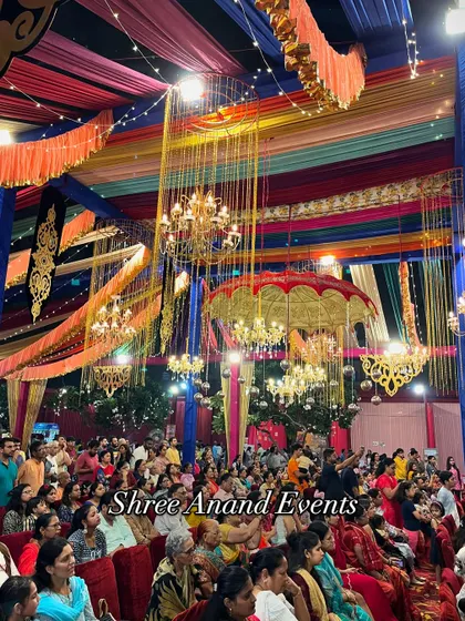 A wide shot of the audience at a large-scale cultural event, showing the massive, colorful tent and decor we provided.