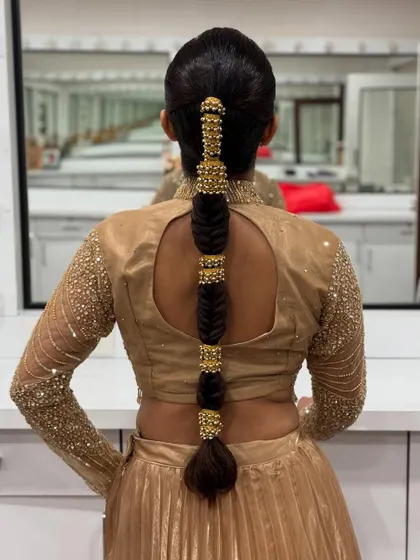 A final shot of the stunning gold-accessorized bubble braid, reflecting beautifully in the studio mirror.