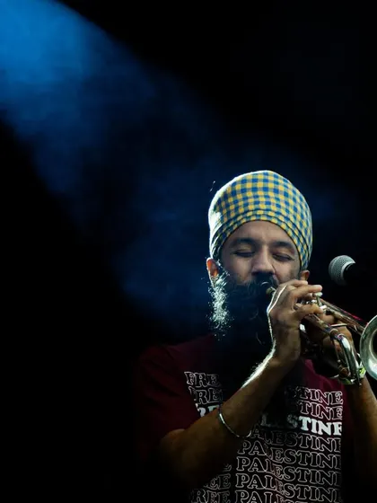 A powerful moment with trumpeter Sonny Singh under the spotlight. His performances bring a unique blend of Punjabi music and jazz to the stage.