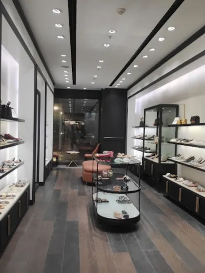 A view of the store's interior showcasing the product display strategy. We used a mix of open shelving and glass cases with specific lighting to highlight the merchandise.