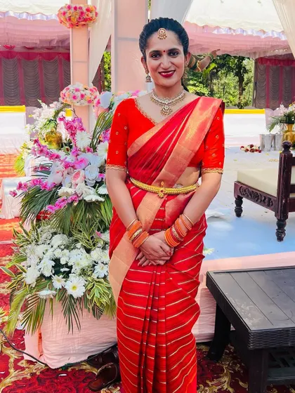 Sahana looking regal in a red striped designer saree from our collection. The simple elegance of this saree makes it perfect for any grand occasion.