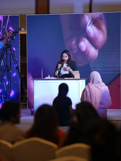 Sharing my passion and expertise is a huge part of what I do. Here I am on stage at the Kolkata Nail Competition, doing a live demo for fellow artists. It's moments like these that push the industry forward.