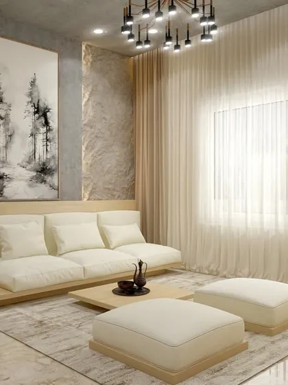 In the same Indian Bohemian home, this seating area uses a low-profile sofa and a neutral palette to create a calm, minimalist zone. The large artwork and textured wall add depth, while sheer curtains diffuse natural light beautifully.