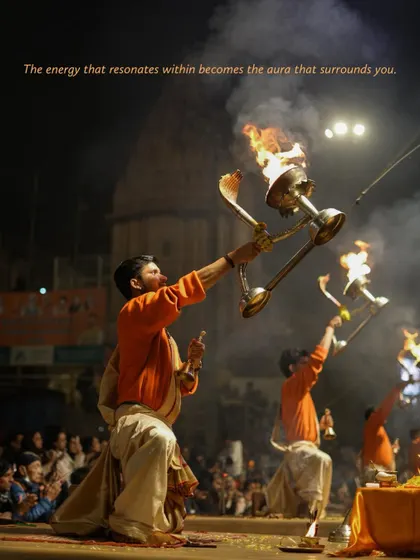 Priests perform the Ganga Aarti, holding large, ornate lamps against the night sky. This image captures the energy and devotion that radiates from this daily ritual, a cornerstone of life in Varanasi.