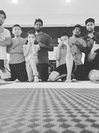 A black and white photo capturing the teamwork that wins championships.