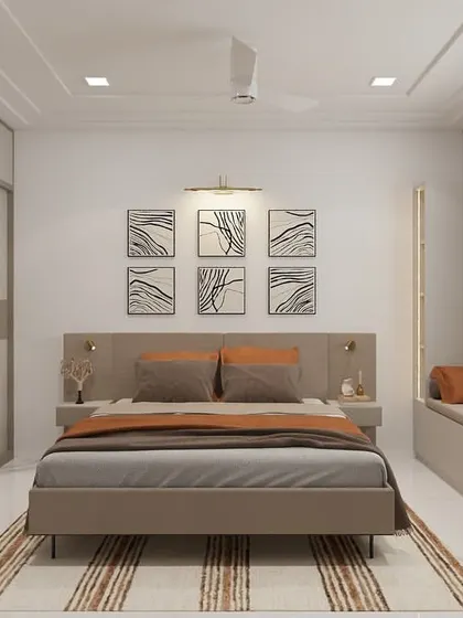 A calm and balanced bedroom design featuring a neutral color palette of beige and brown. The room includes a comfortable window seat, a sleek sliding wardrobe, and abstract art above the bed to add a touch of personality.