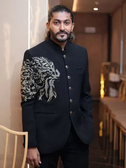 The clean lines and bold design of our black Jodhpuri suit make it a top rental choice for engagements and sangeet nights.