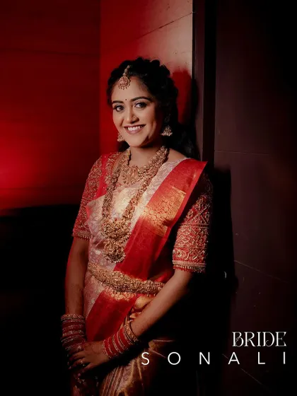 A beautiful portrait of the bride at her reception, with a simple text overlay naming her.