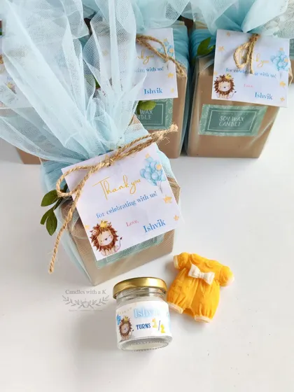 The complete gift set for a half-birthday, including the mini candle and the adorable baby onesie wax sachet, all beautifully packaged.
