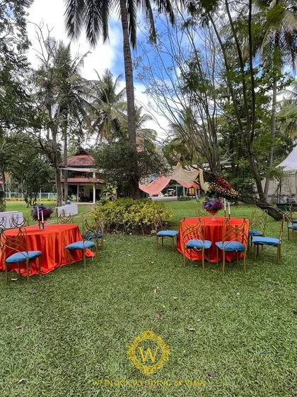 The seating for this outdoor Mehendi featured colorful woven chairs and ottomans, perfectly matching the vibrant, festive theme of the event.
