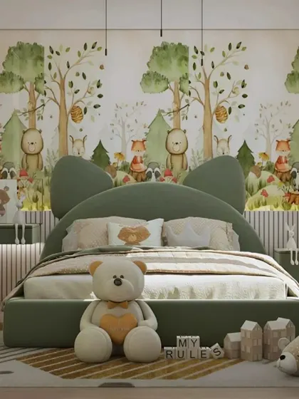 A charming, nature-themed bedroom for a young child. We used a forest animal wallpaper and a custom bed with cat-ear headboard to create a sweet and imaginative space.