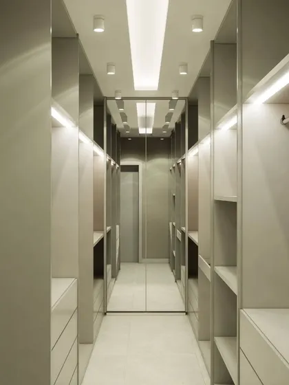 A full view of the walk-in closet from image 103, showing its depth and extensive storage capacity.
