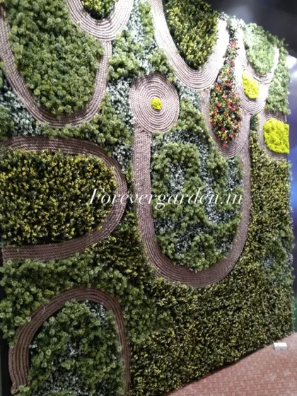 A highly customized green wall featuring intricate patterns made with rope, creating a unique and artistic landscape effect.