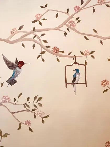Another close-up from the Cafe Wink project, highlighting a hummingbird and a bird in a cage, adding to the charming, classic theme.