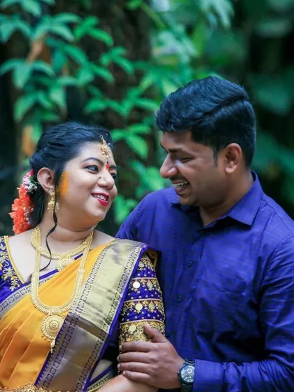 A happy couple sharing a laugh during one of their wedding events. We live for these candid, joyful moments.